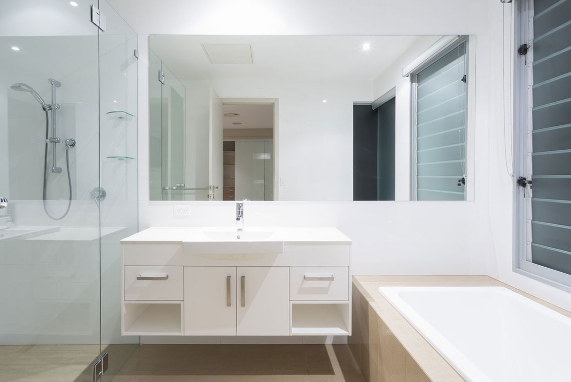 Bathroom with a mirror installed on the wall