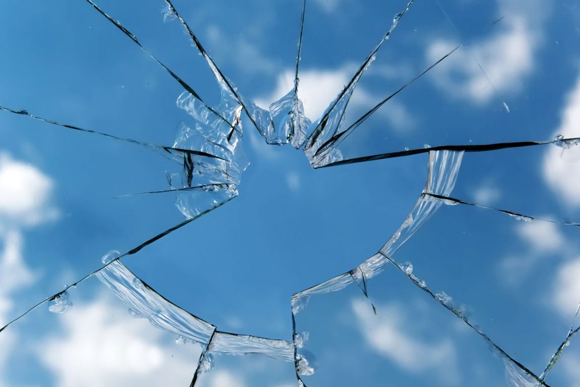 A smashed glass window